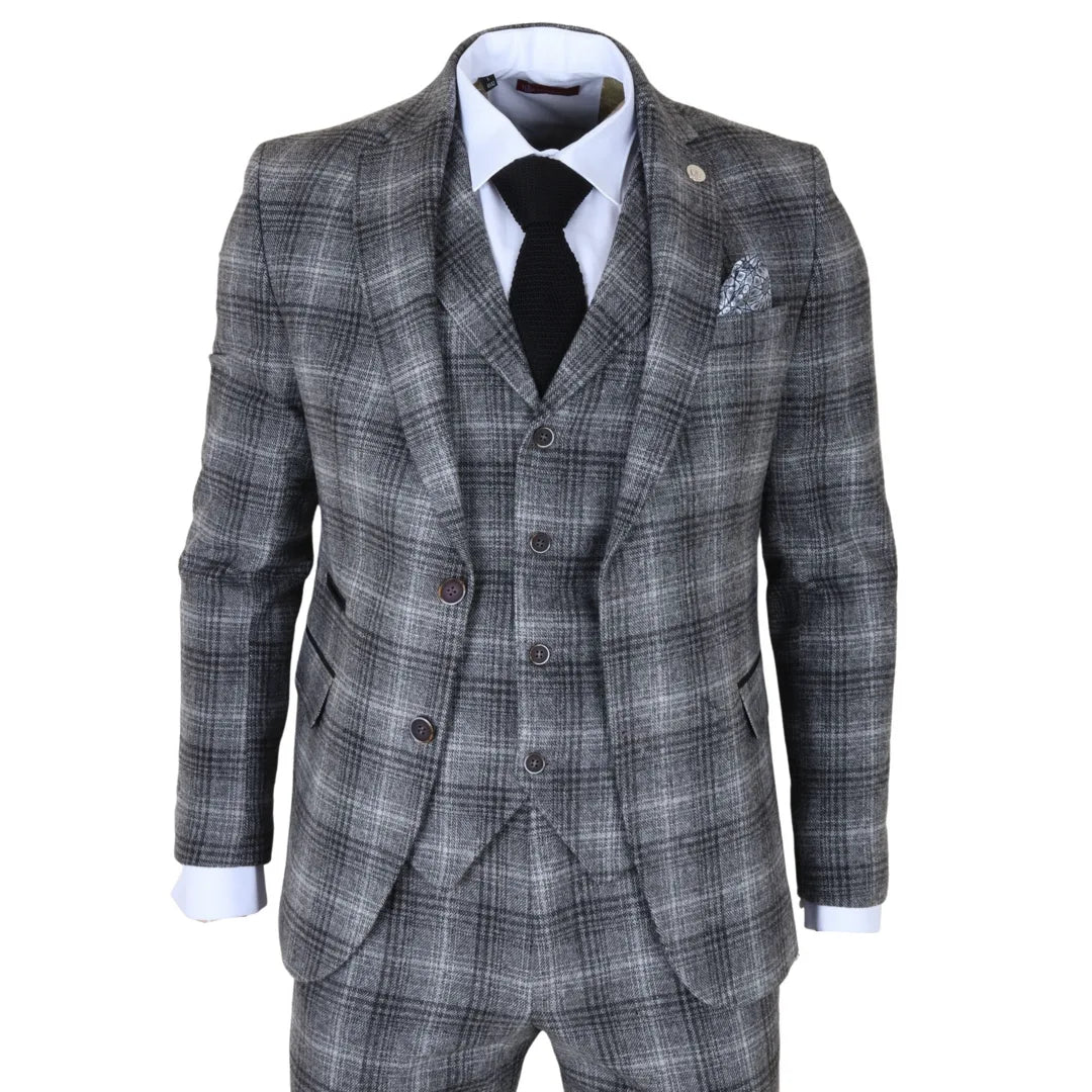 Gray checkered suit with a white shirt, black tie, and pocket square on a white background