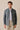 Heren safari-jas van saliegroen katoenmix en beige broek, smart casual outfit