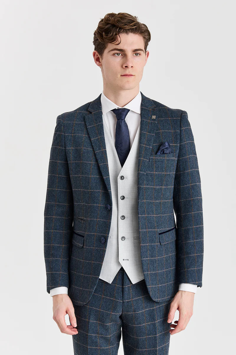 Harris marineblauwe tweedpak met contrasterend Belmont zilverkleurig vest.