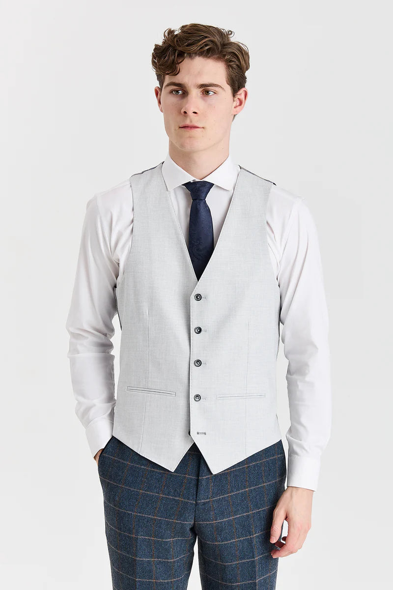 Harris marineblauwe tweedpak met contrasterend Belmont zilverkleurig vest.