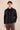 Herenset: zwarte linnen jas met rits en bruine broek, smart casual zomeroutfit