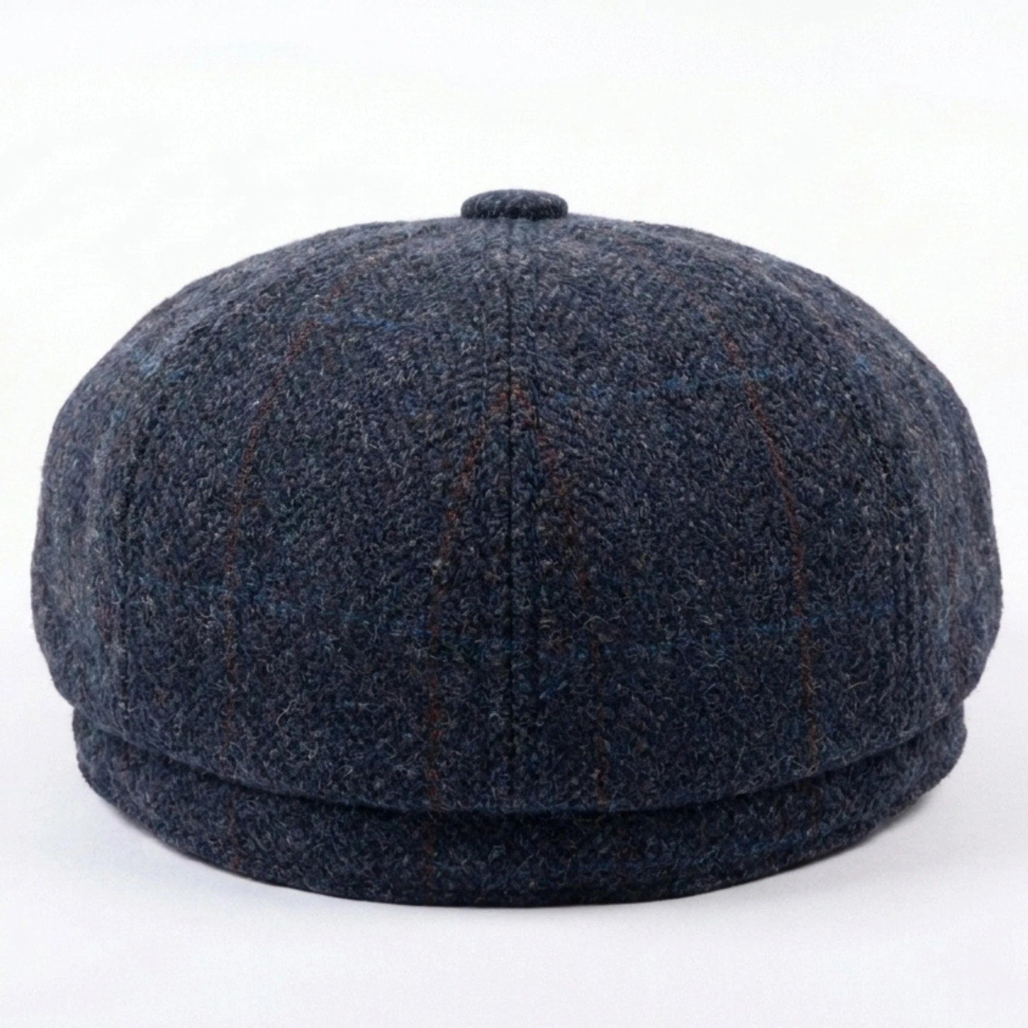 Herenpet in marineblauwe wollen tweedstof, model newsboy.